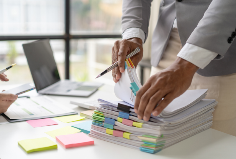 personal injury lawyer organizing legal documents on desk at sobo and sobo law firm