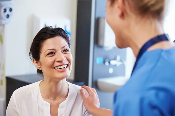 Woman talking with a doctor during a medical consultation