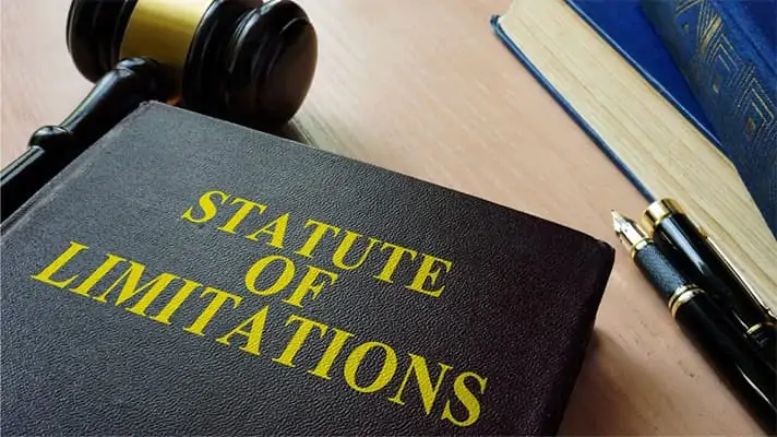 Gavel resting beside a legal book titled Statute of Limitations