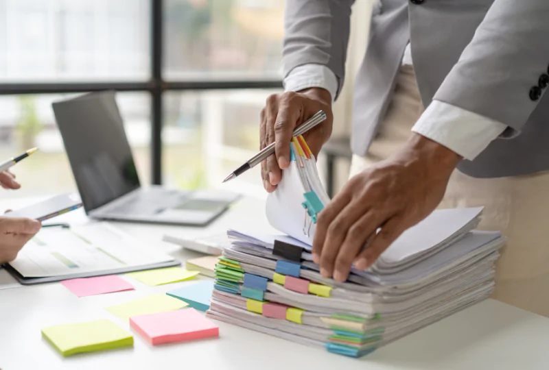 personal injury lawyer organizing legal documents on desk at sobo and sobo law firm