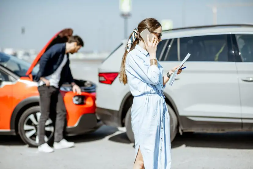 woman debating with insurance on raising premiums after an accident